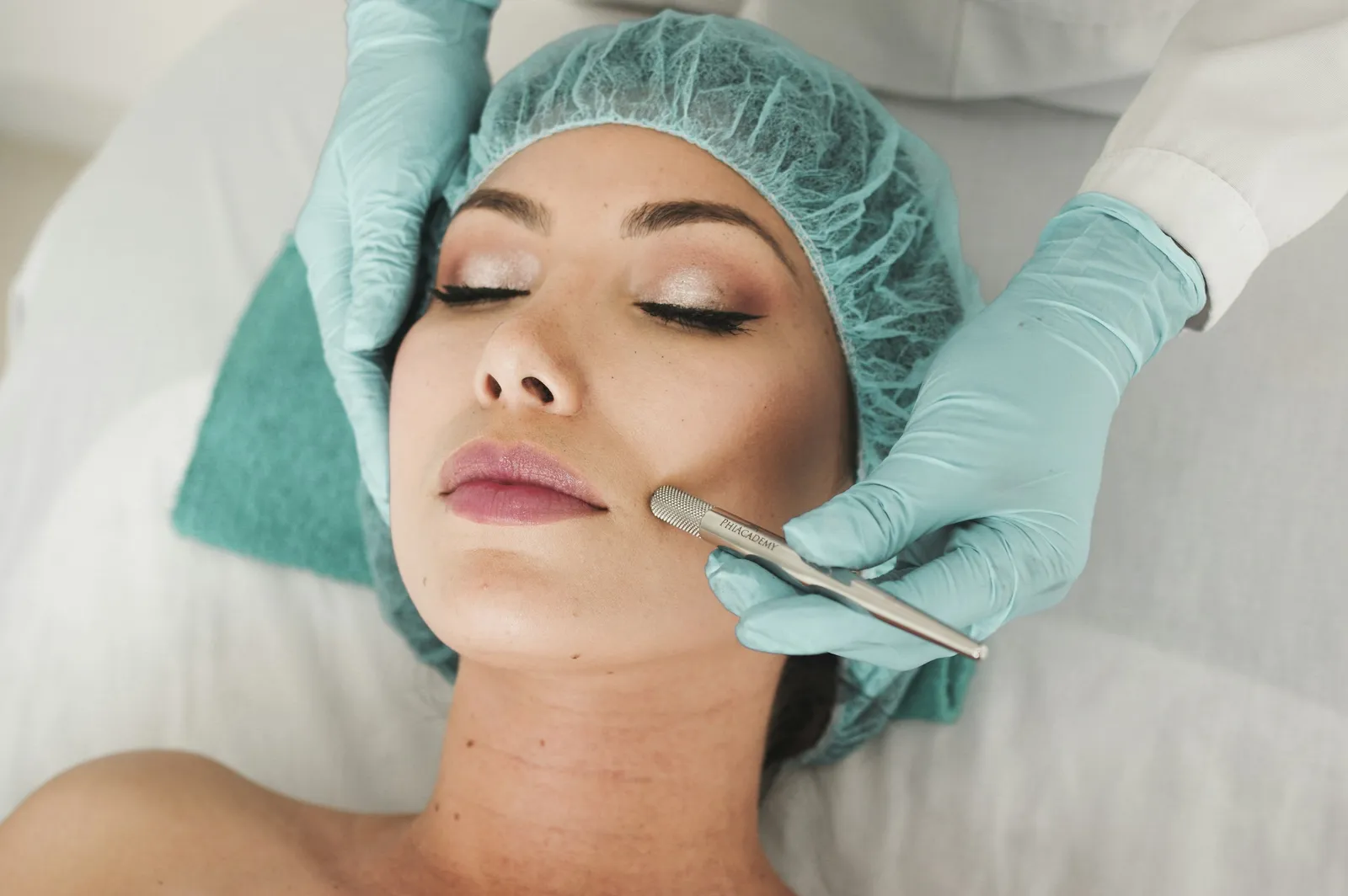 Therapist performing extractions during a facial