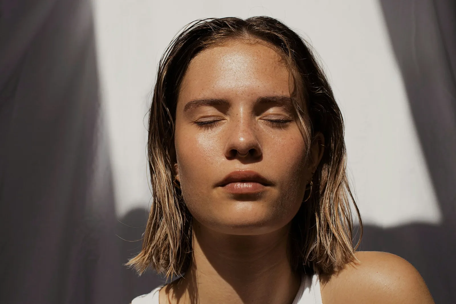 Woman with sunlit, even-toned skin